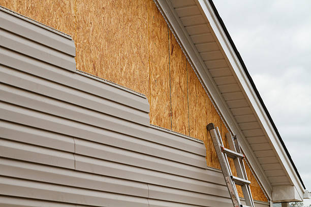Professional Emergency Siding Repair technician working in Corning, OH